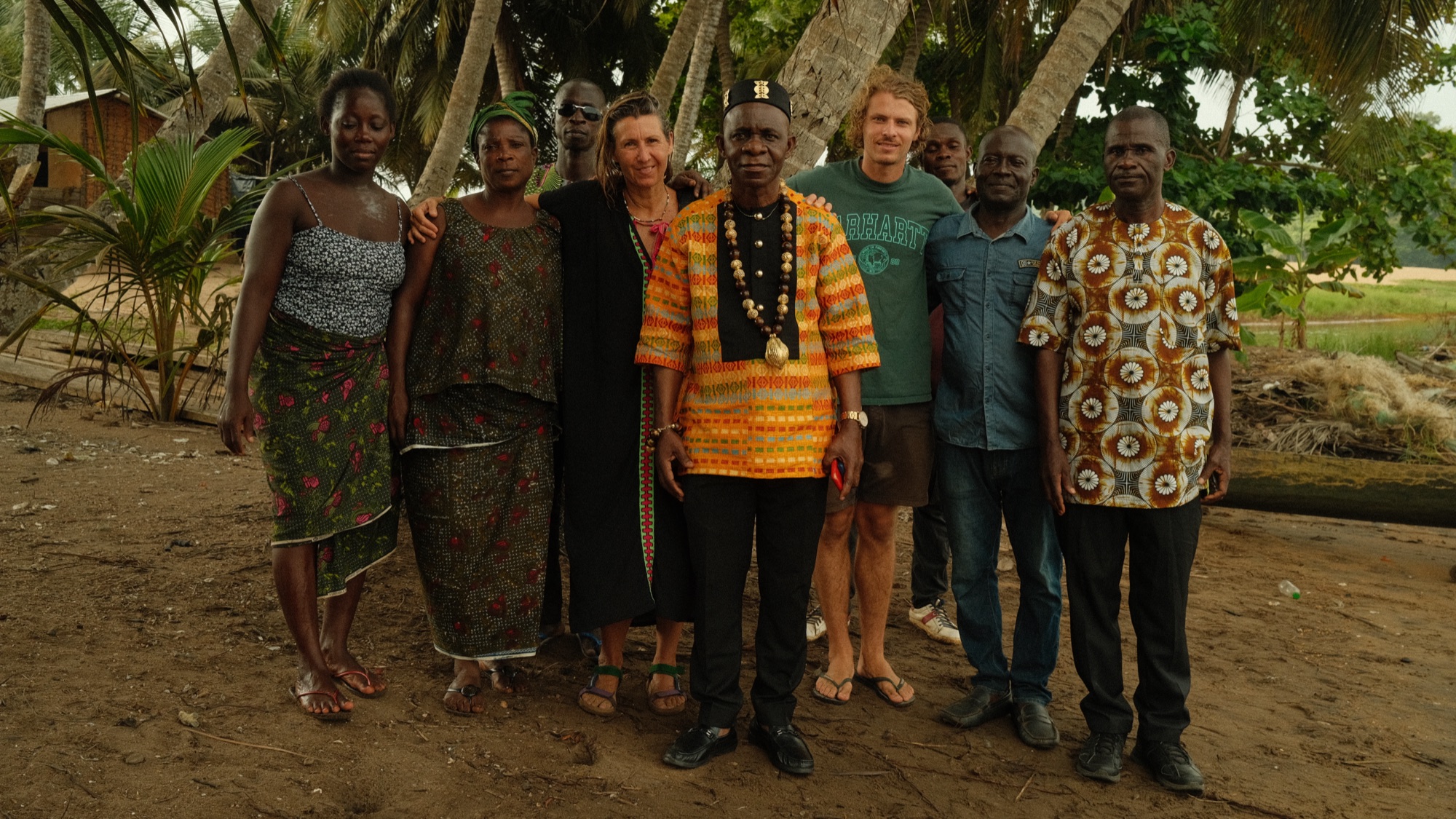 Meeting a village chief and his community, under the palm trees